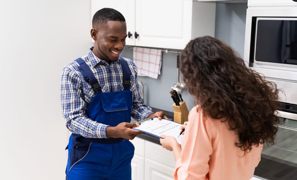 hvac-service-tech-customer-1226620484