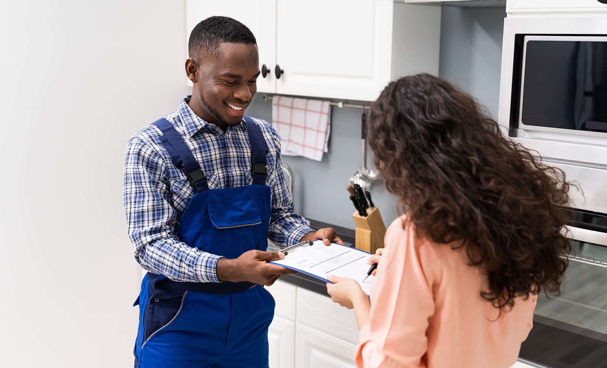 hvac-service-tech-customer-1226620484