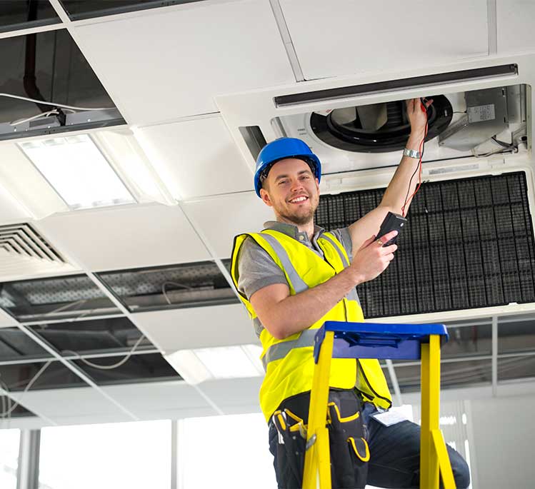inspecting-Air-duct-in-Office